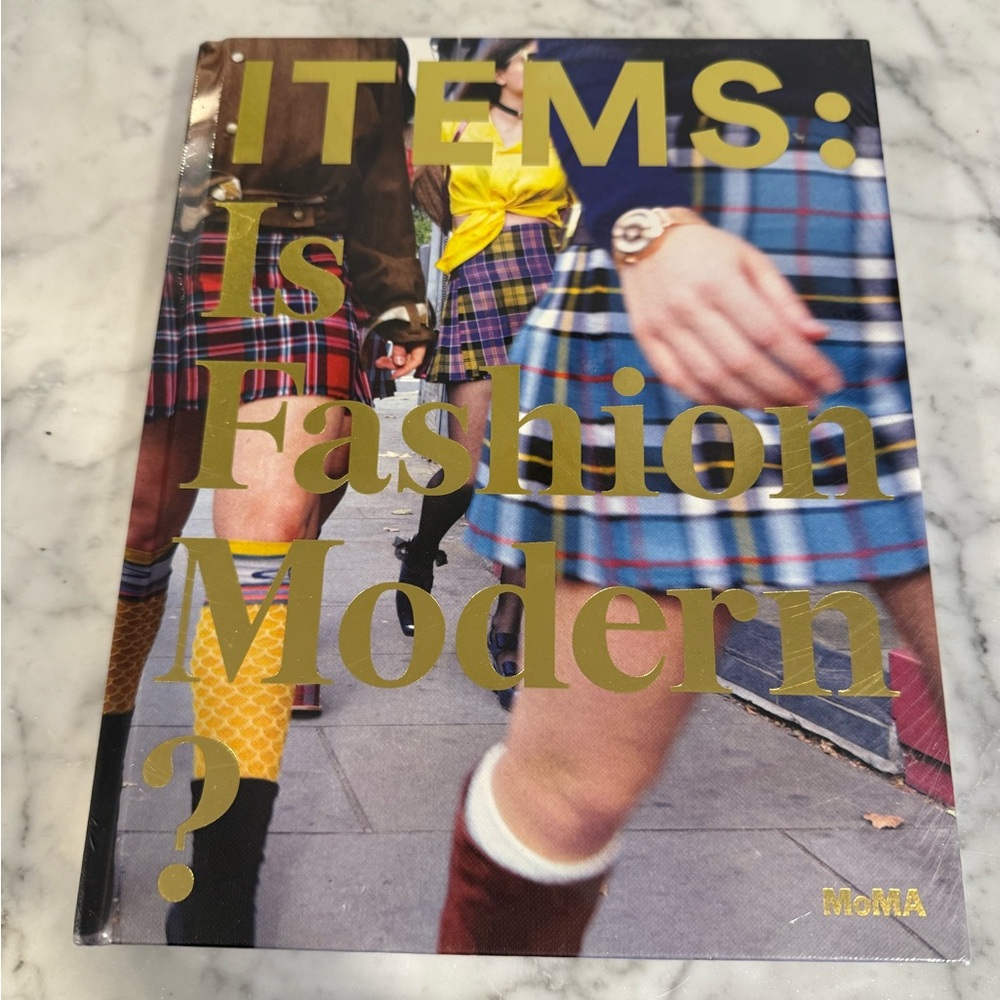 MoMA Fashion Influence Book with Red and Gold Accents